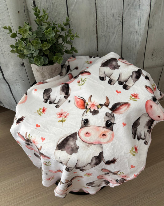 Couverture en squish Vache champs de fleurs rose